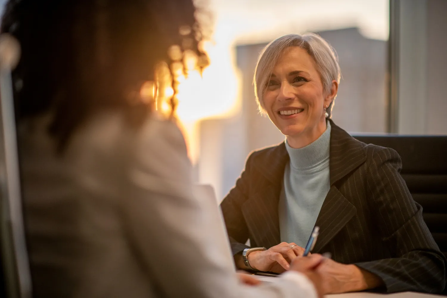 Manager and employee talking.