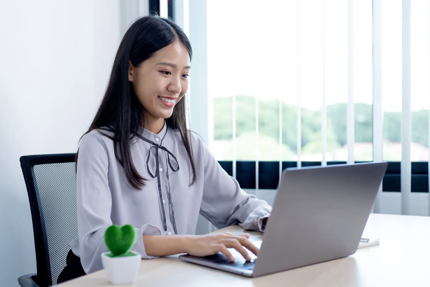 Woman working on her laptop.