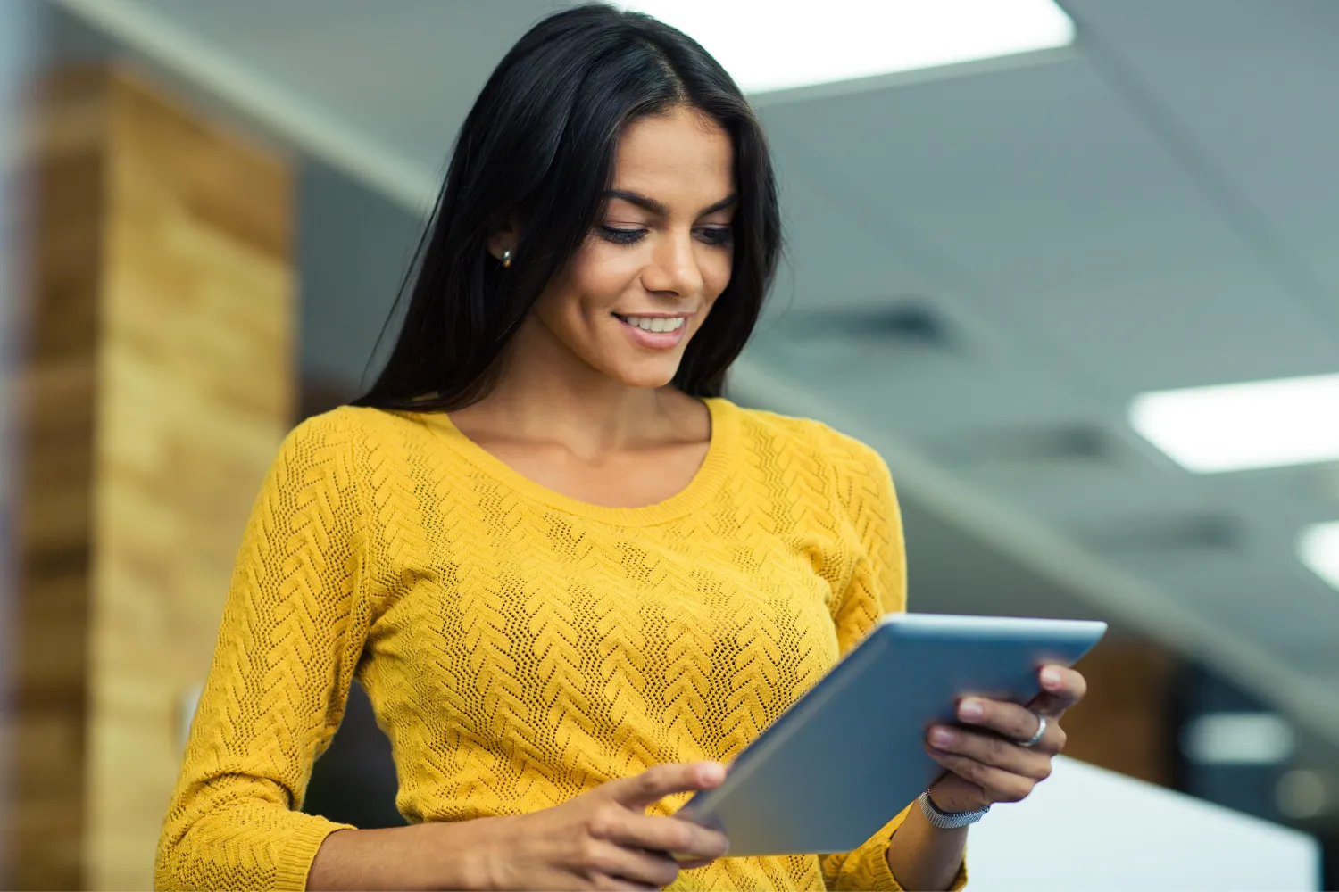 A remote worker looking at tablet.