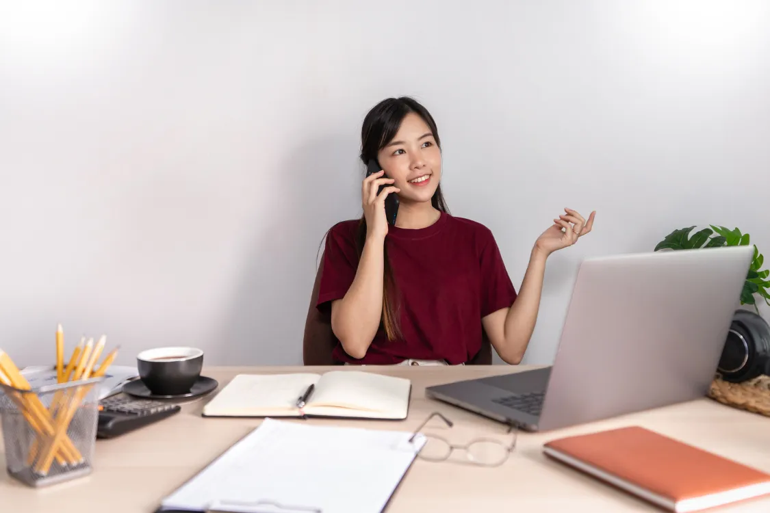 Filipino remote employee on a call clarifying role expectations while working from home.
