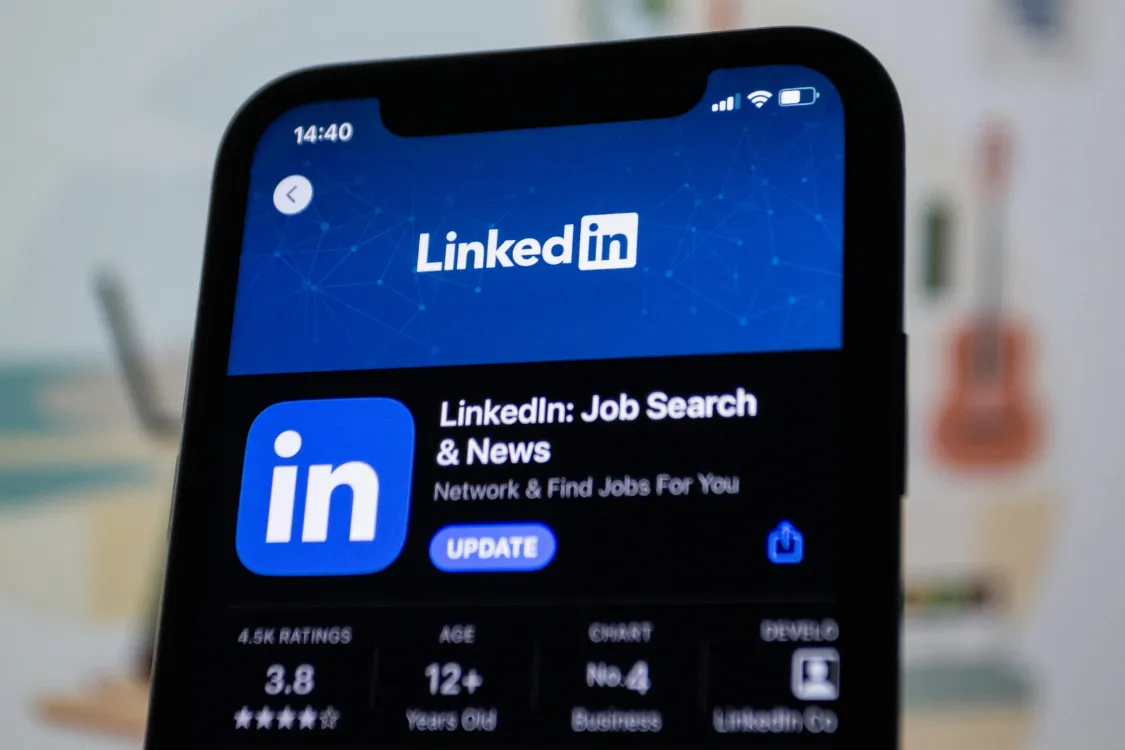 LinkedIn Job Search and News mobile app open on a phone, used for finding Filipino professionals online.