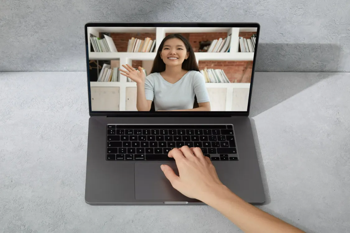 Job interview in progress showing a Filipina applicant on a laptop scree