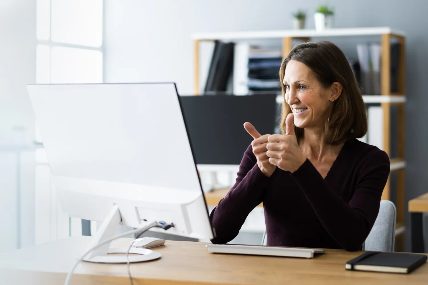 A foreign business owner giving feedback through online video call.