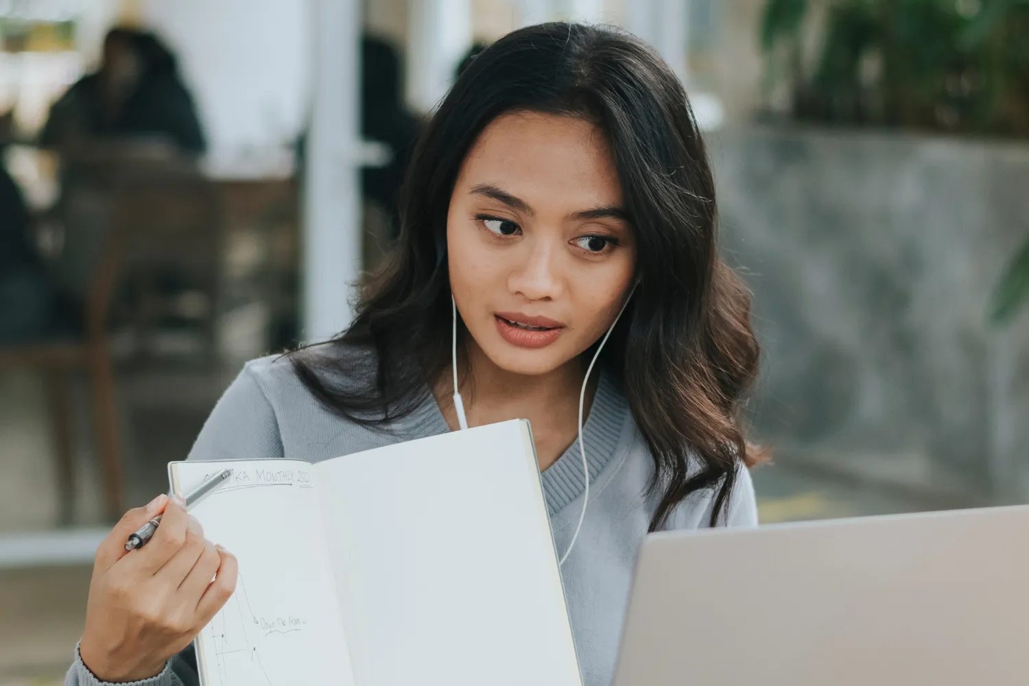 A remote worker presenting via video call.
