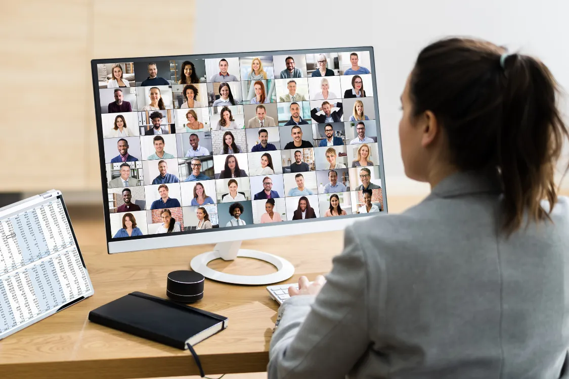 Female leader conducting a large virtual team meeting with offshore staff