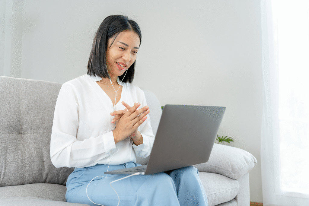 Woman talking to her laptop.