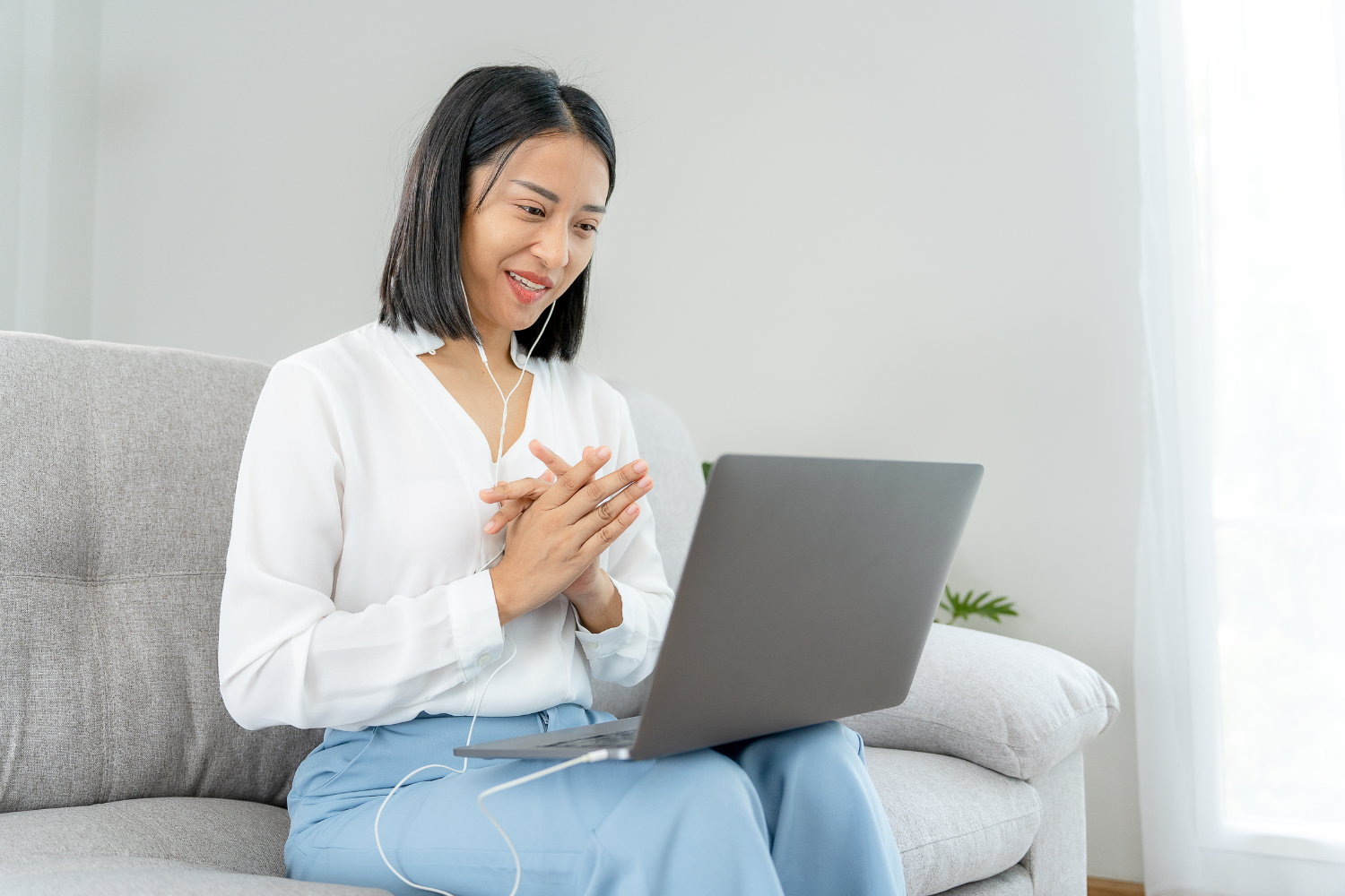 Woman talking to her laptop.