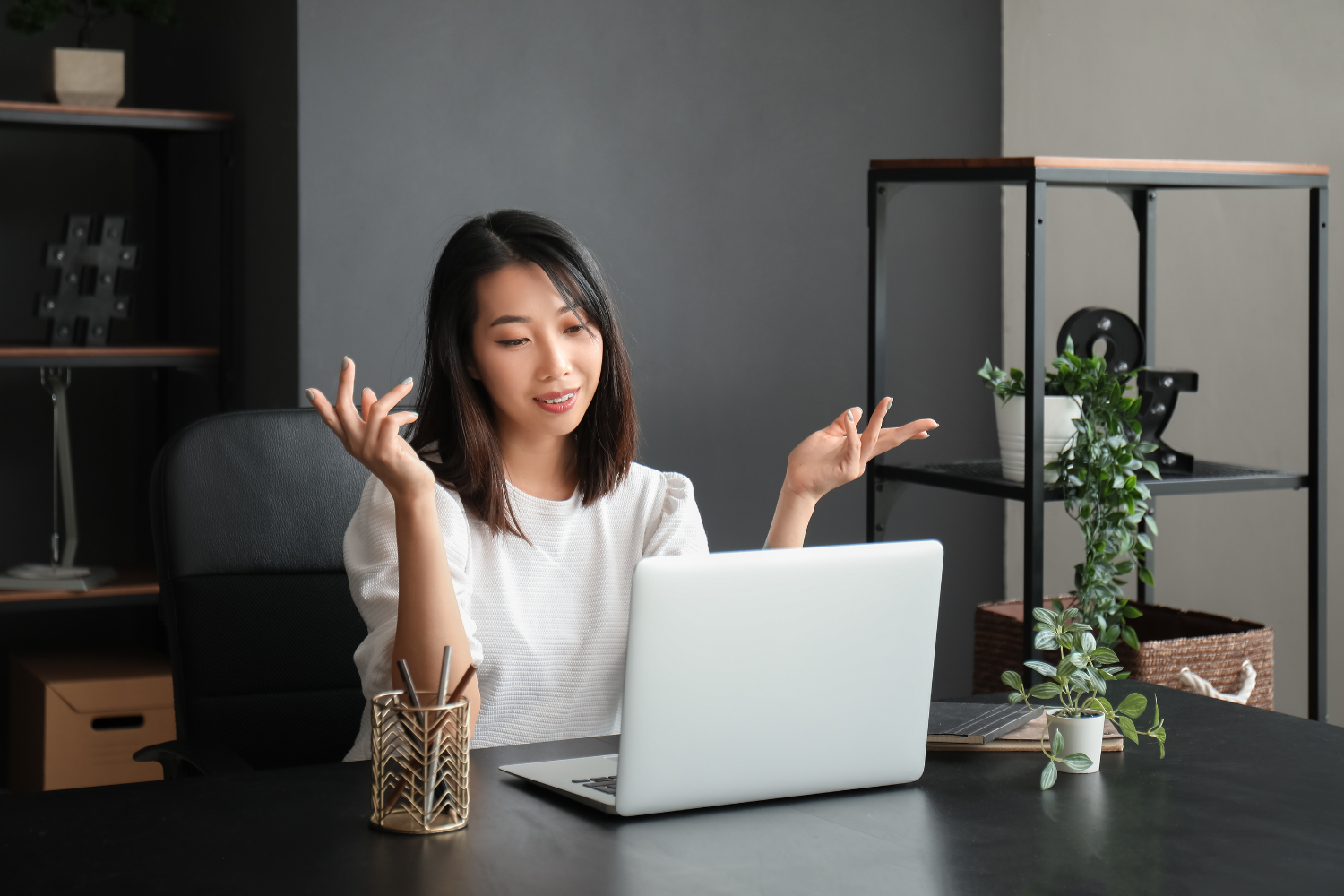 Woman talking via video call with animated hands.