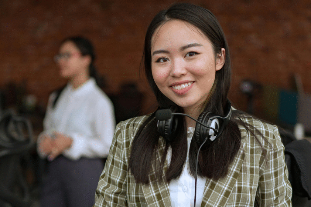 Smiling Filipino professional with a headset, representing the Philippines’ strong presence in customer service and virtual assistant roles.