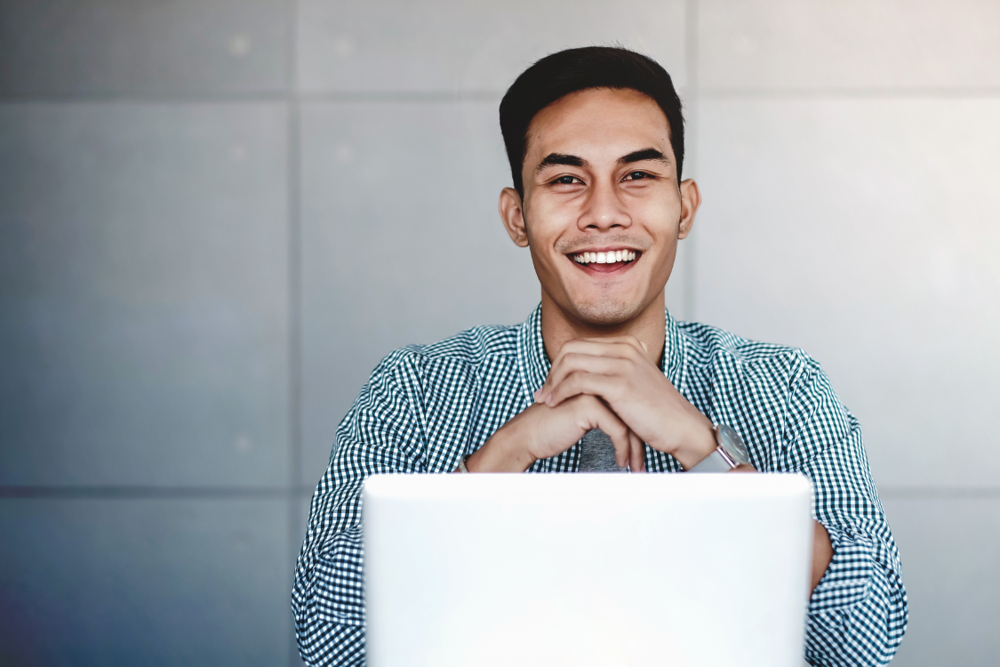 Confident Filipino male candidate preparing for final interview online