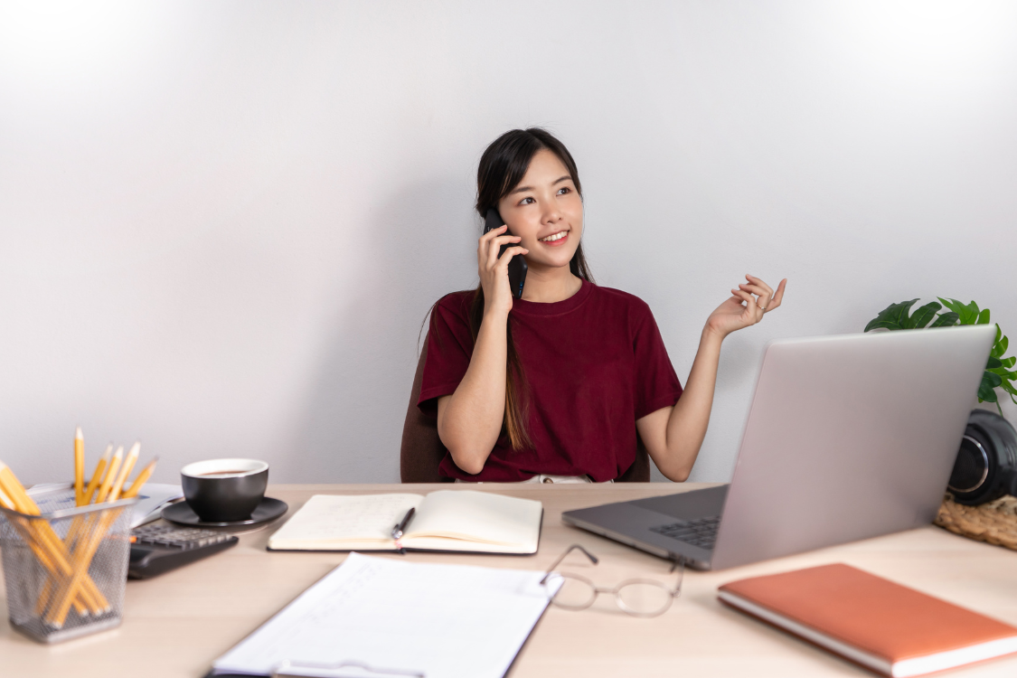 Filipino remote employee on a call clarifying role expectations while working from home.