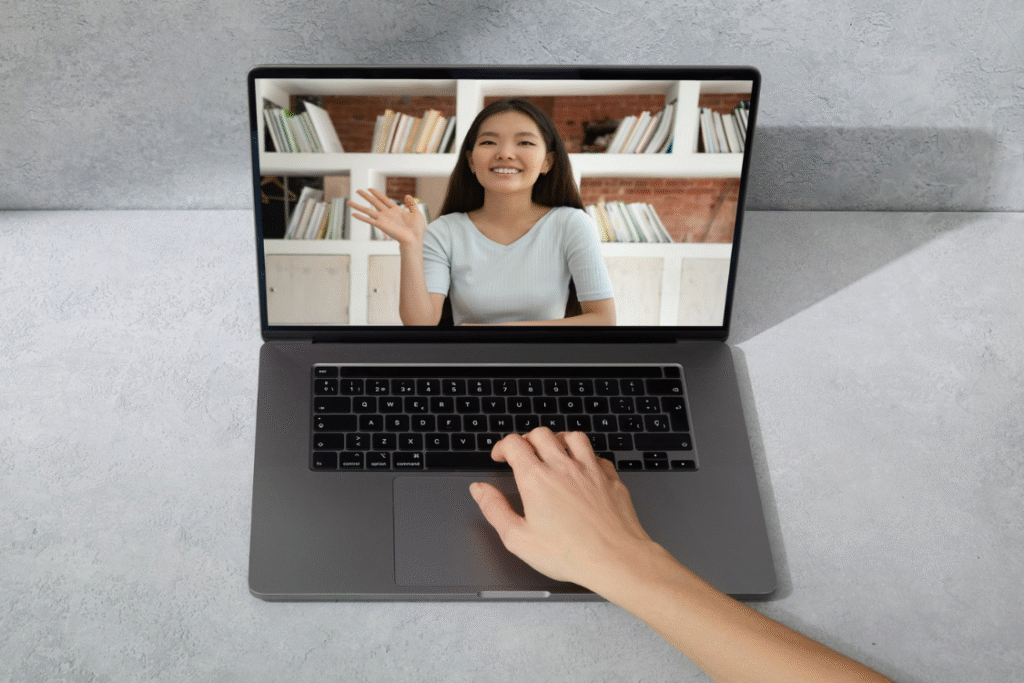 Job interview in progress showing a Filipina applicant on a laptop scree
