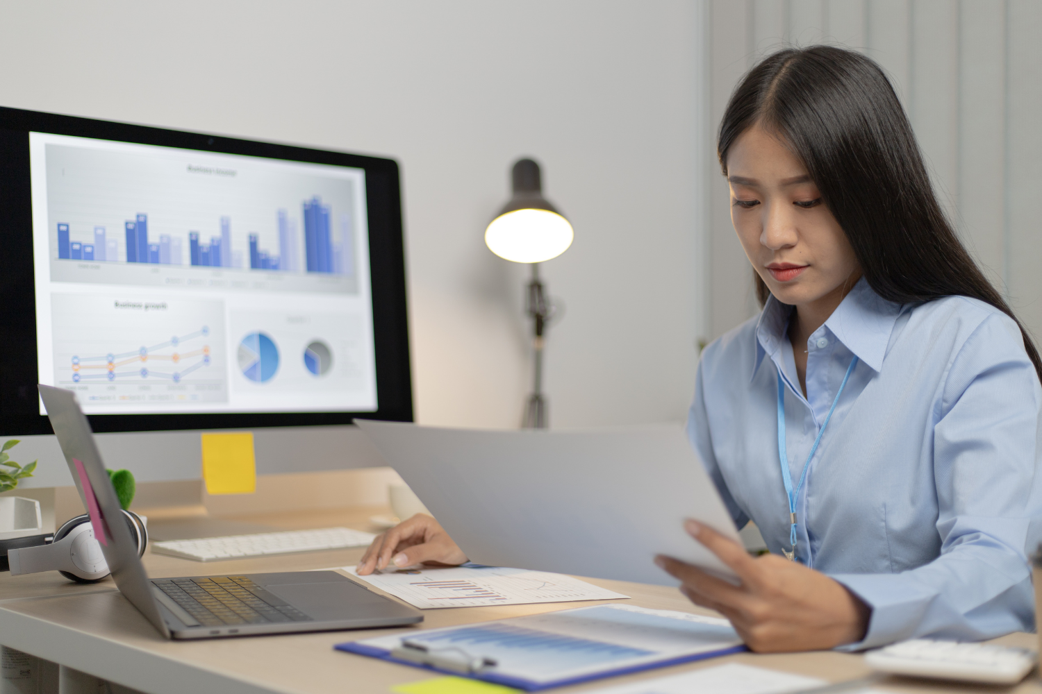 Employee reading through documents while working at home.