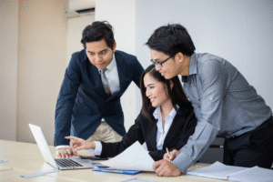 A team checking something on a laptop.