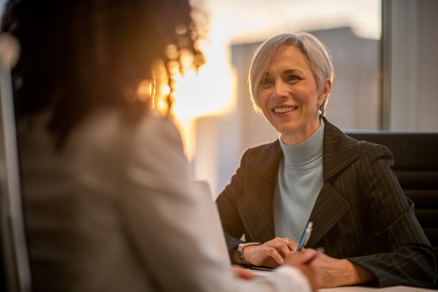 Manager and employee talking.