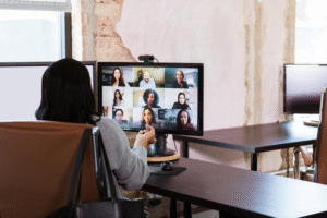 Woman on video meeting with other remote colleagues.