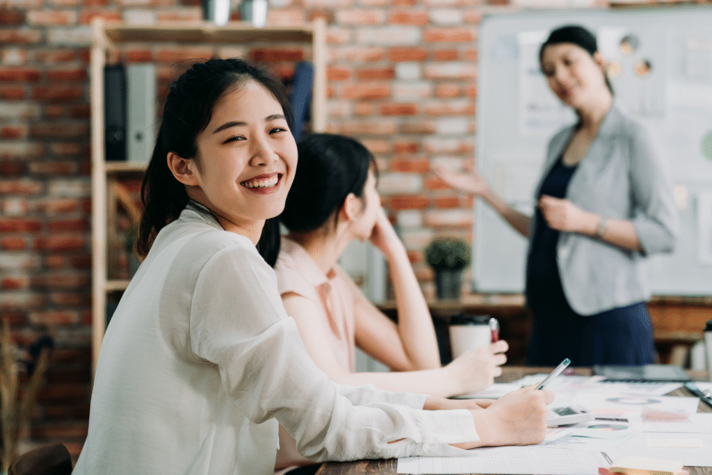 Employee smiling during a meeting.