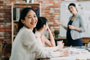 Employee smiling during a meeting.