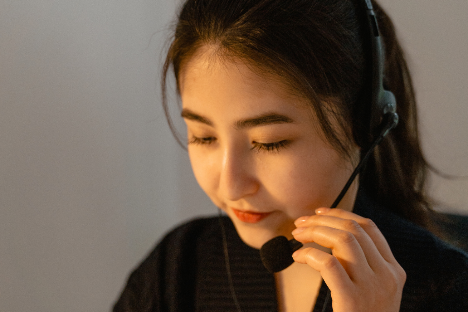 Remote employee speaking through headset.