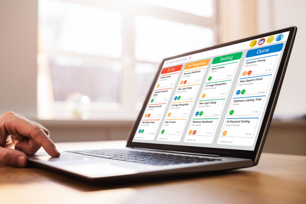 Project management software shown on laptop.